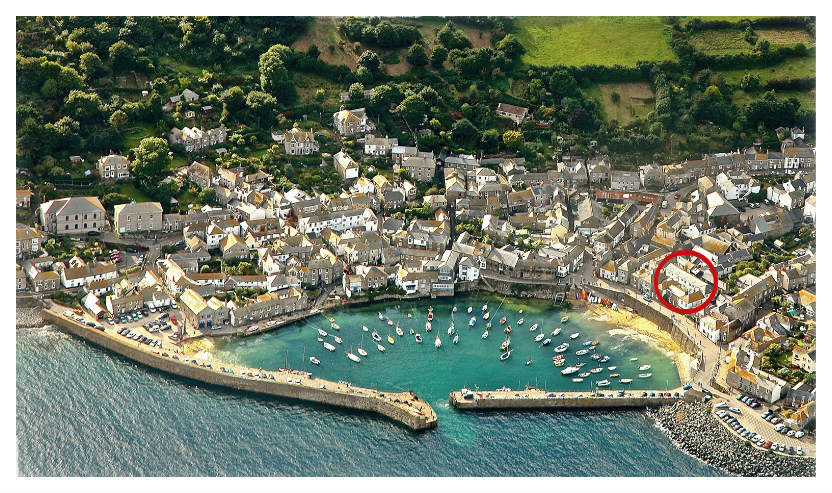 Mousehole harbour with Abbey Place Net Loft circled in red on the quayside
