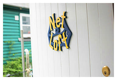 The front door of Abbey Place Net Loft in a narrow Mousehole street