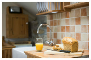 The kitchen worktop and cupboards