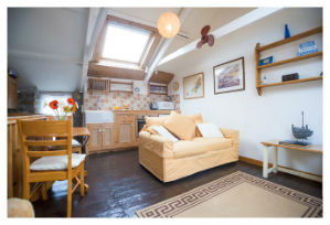 The lounge, with sofa bed and armchair